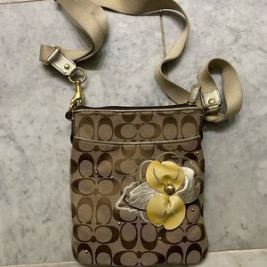 Coach cross body purse with floral appliqué